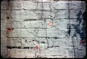 Elijah Harlan House, chimney.  Up arrow shows footprint of Atlanta B Harlan, left arrow says Feb 1823, down arrow says A B Harlan -- in effect a birth certificate in wet brick, fired  (Photo courtesy of Guy and Anna (Russell) Ingram, Danville, Ky).