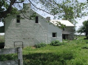 Elijah Harlan House with stone slave quarters on right (Photo by the author, April, 2012)