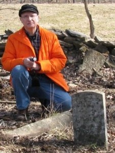 The author at two of the three extant headstones, B F (standing) and T J lying at my knee. The stone of W M is to my right, leaning against a tree. Broken stubs of dressed stone indicate more burials, the dry stone wall may contain more headstones or remnants. A seriously endangered cemetery.