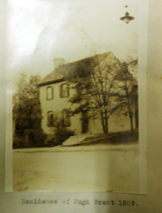 This picture of Hugh Brent’s house was recently found in a notebook compiled by Edna Whitley, Bourbon County historian, and kept in the archives of Hopewell Museum in Paris, Kentucky. Mrs. Whitley noted that the house was torn down in 1920, but she preserved this photograph in a lecture she gave which is included in the notebook. This lecture was also an article in the Kentucky Register (Mrs. W.H. Whitley, A Glimpse of Paris in 1809, Register of Kentucky State Historical Scoiety, Vol 20, No 58 January, 1922 pp. 49-57), but was not illustrated. This house is known as the first brick house in Paris, but the site is now a vacant lot at the corner of 2nd and Main Streets.